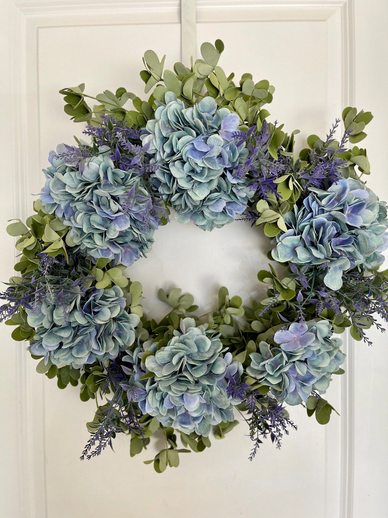 A Beautiful Blue Hydrangea Wreath With Sprigs Of Lavender Is Made On A ... with regard to