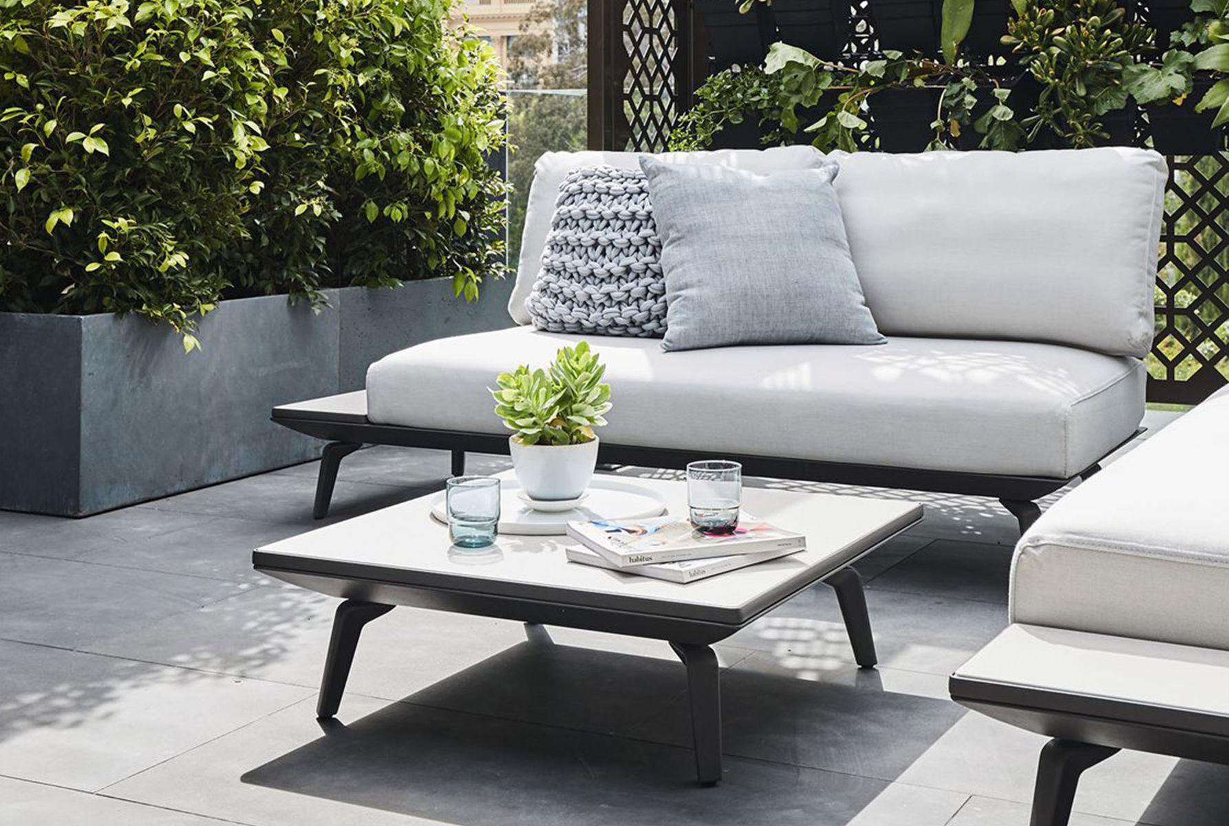 Create An Outdoor Oasis with regard to Cove White Upholstery Outdoor Sofa
