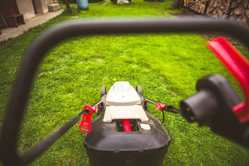 Gardener By Electric Lawn Mower Cutting Green. Backyard Care Concept ... regarding How electric eco lawn mower sustainable technology is transforming yard care